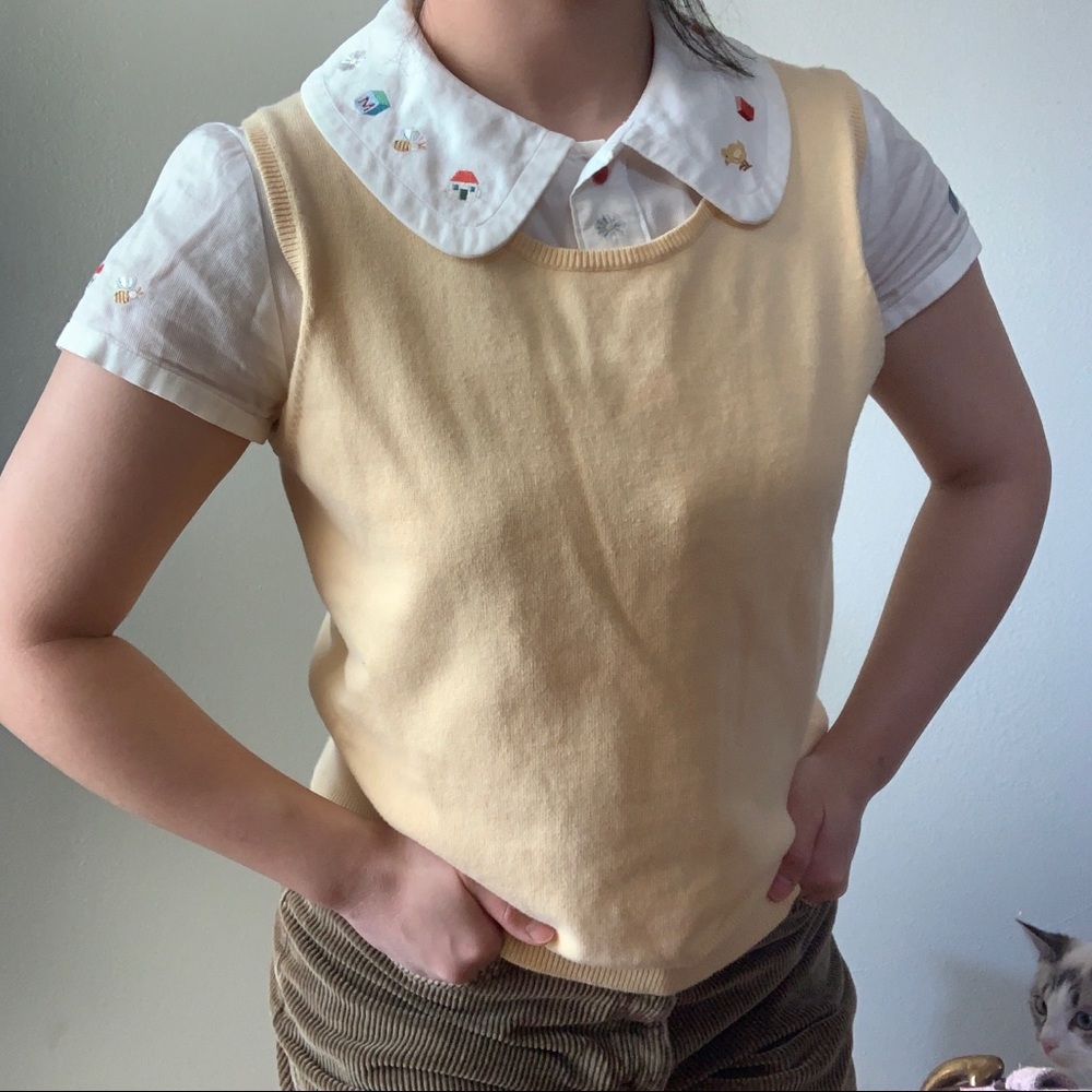 Yellow sweater vest